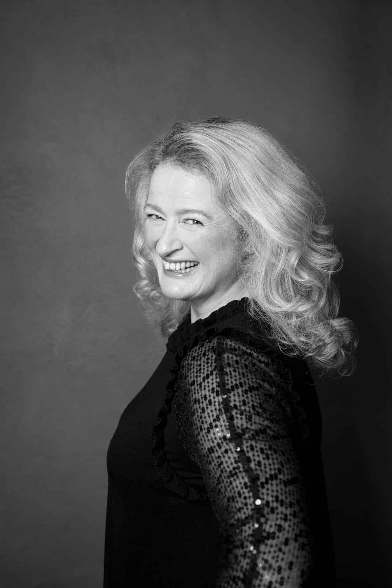 Black-and-white portrait of a woman at Oliver Doran Studios